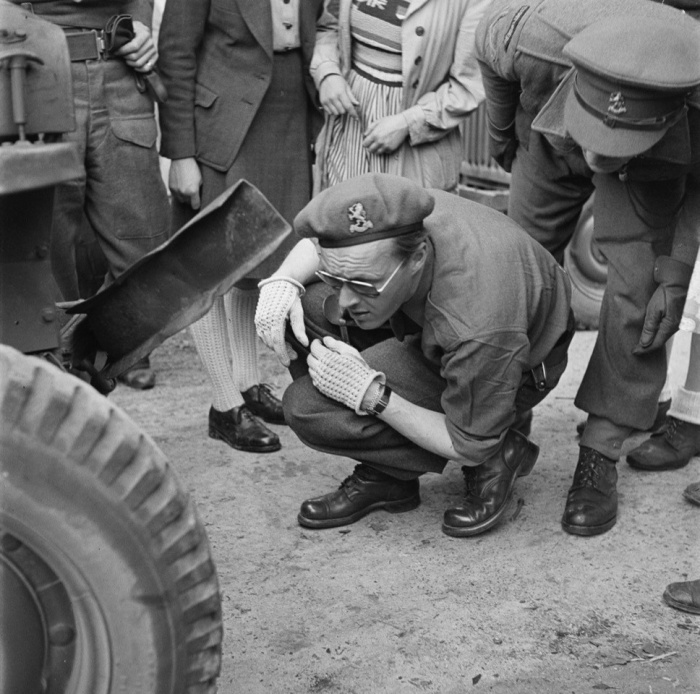 Prince Bernard inspecting his Jeep after a collision in May 1945